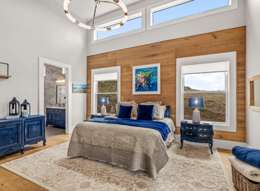 This stunning bedroom boasts a blend of rustic charm and modern elegance.