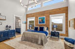 This stunning bedroom boasts a blend of rustic charm and modern elegance.