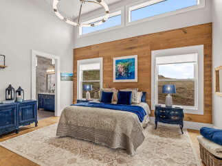 This stunning bedroom boasts a blend of rustic charm and modern elegance.