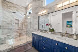 Step into luxury with this stunning bathroom featuring exquisite marble finishes and a spacious walk-in shower.