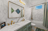 Step into luxury with this stunning bathroom! Featuring a sleek marble design, gold fixtures, and a spacious vanity, this space is perfect for relaxation.