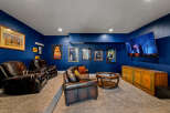 Step into luxury with this stunning home theater! Featuring plush leather seating, a large screen TV, and a stylish entertainment console, this space is perfect for movie nights and entertaining guests.