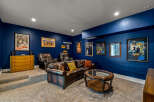 Step into your dream home theater! This stunning space boasts a luxurious leather sofa, perfect for movie nights.