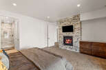 This luxurious bedroom boasts a cozy fireplace with a mounted TV, perfect for relaxing evenings.