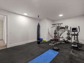 This home gym offers a dedicated space for fitness enthusiasts.