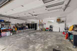 This spacious garage offers ample room for storage and projects.
