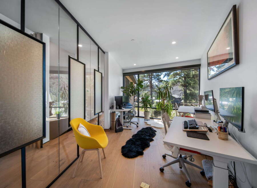 This modern office space boasts a bright and airy atmosphere, perfect for productivity.