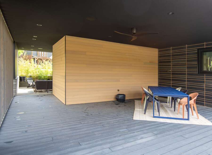 This stunning outdoor space offers a perfect blend of modern design and natural elements.