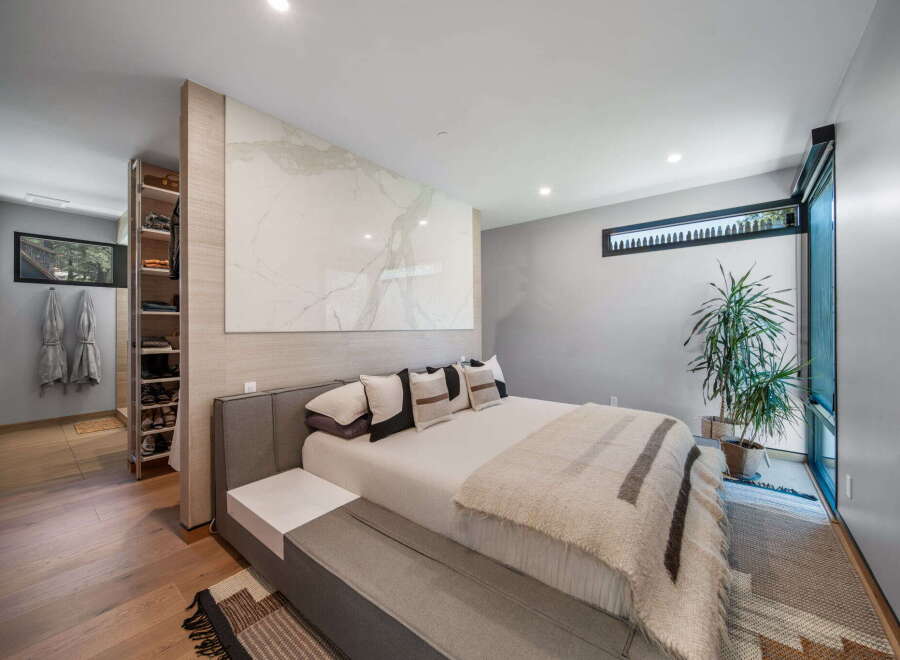 Step into luxury with this stunning bedroom featuring a modern design and elegant finishes.