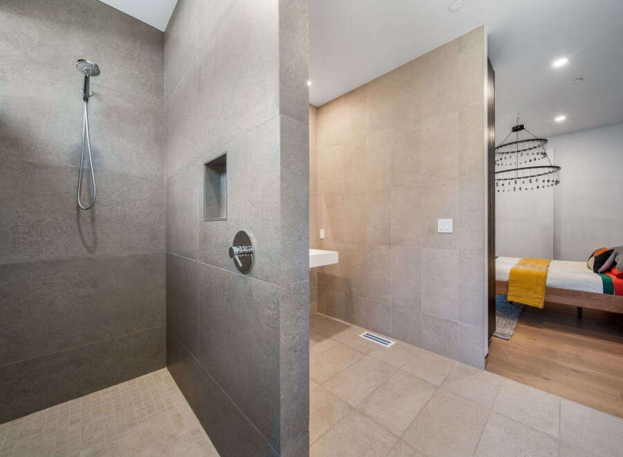 Step into luxury with this stunning bathroom featuring a modern shower design.