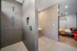Step into luxury with this stunning bathroom featuring a modern shower design.