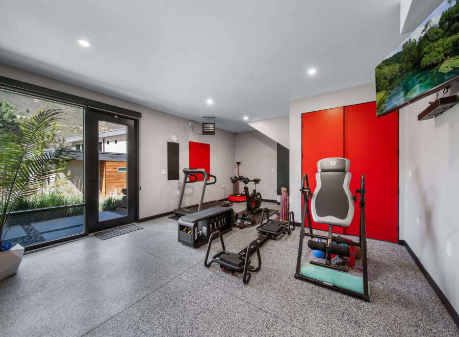This modern home gym offers a dedicated space for fitness enthusiasts.
