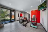 This modern home gym offers a dedicated space for fitness enthusiasts.