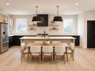 Step into this stunning modern kitchen, featuring sleek black cabinetry and a spacious island perfect for entertaining.