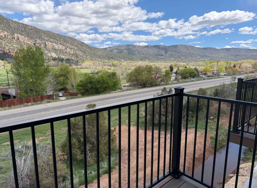 Enjoy breathtaking mountain views from this stunning property! This home offers a serene setting with a private balcony overlooking a picturesque landscape.