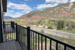 Enjoy breathtaking mountain views from this stunning property! This home features a private balcony with a sleek black railing, perfect for relaxing and taking in the scenery.