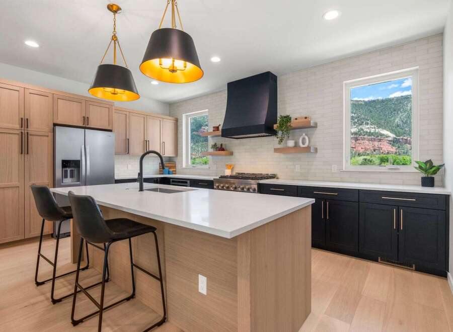 This stunning kitchen boasts a modern design with sleek cabinetry and a spacious island, perfect for both cooking and entertaining.