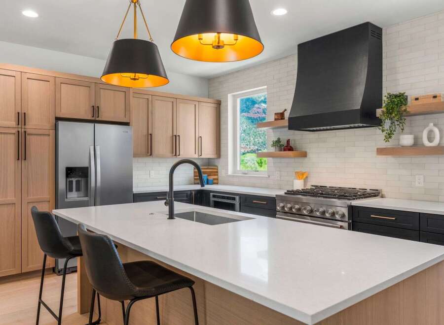 This stunning kitchen boasts a modern design with sleek cabinetry and a spacious island, perfect for culinary enthusiasts.