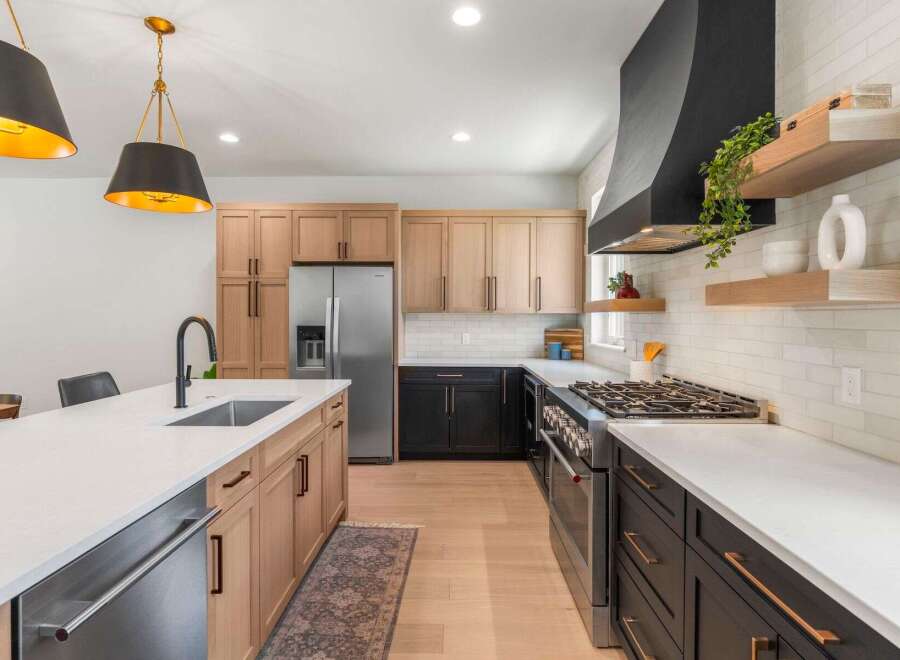 This stunning kitchen boasts a modern design with sleek cabinetry and high-end appliances.