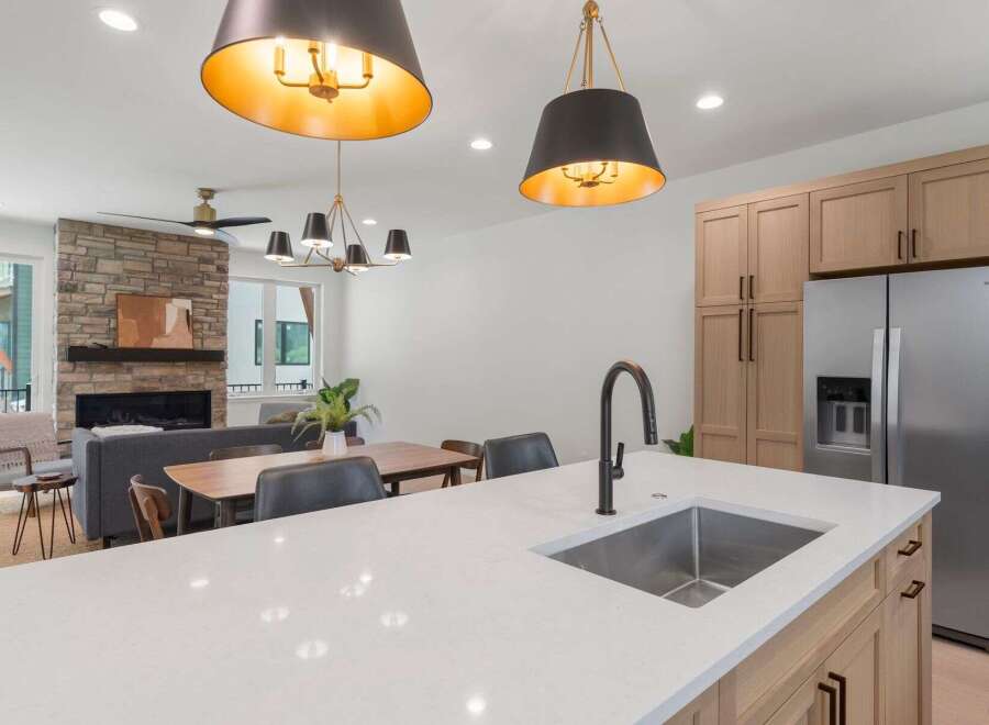 This stunning kitchen boasts modern design with sleek countertops and stainless steel appliances.