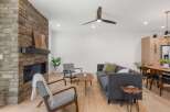 This stunning property boasts a cozy living room with a beautiful stone fireplace, perfect for those chilly evenings.