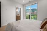 Experience breathtaking views from this stunning bedroom! This property boasts a luxurious interior with a modern design and ample natural light.