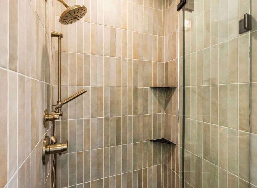 Step into luxury with this stunning bathroom featuring a modern shower design.