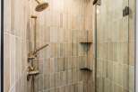 Step into luxury with this stunning bathroom featuring a modern shower design.
