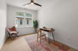 This stunning room features a modern desk and chair, perfect for a home office or creative space.