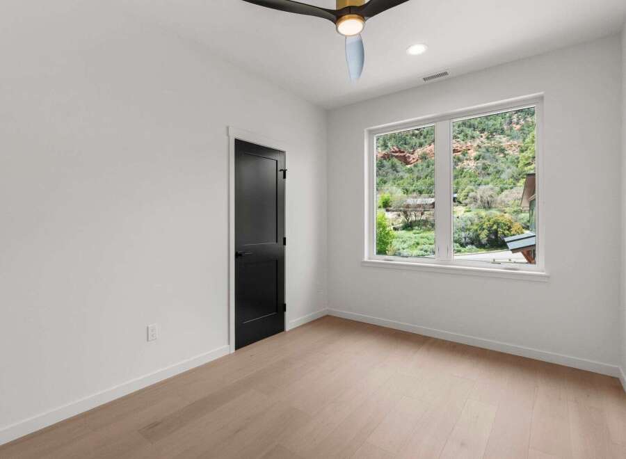 Step into this bright and airy bedroom, featuring a modern design with sleek lines and a neutral color palette.