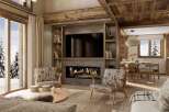 Experience luxury living in this stunning property featuring a cozy fireplace and a modern entertainment center.