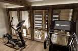 Step into your dream home gym, complete with state-of-the-art equipment and stunning natural light.