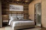 Experience the epitome of rustic elegance in this stunning bedroom.