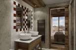Experience luxury living in this stunning property, featuring a beautifully designed bathroom with a unique checkered tile mirror frame.