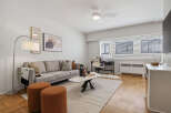 Discover modern living in this stylish apartment, featuring a spacious living area with a comfortable sofa and elegant decor.