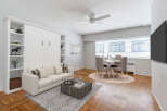 Discover modern living in this stylish apartment! Featuring a bright living area with a comfortable sofa and a chic coffee table, perfect for relaxing or entertaining.