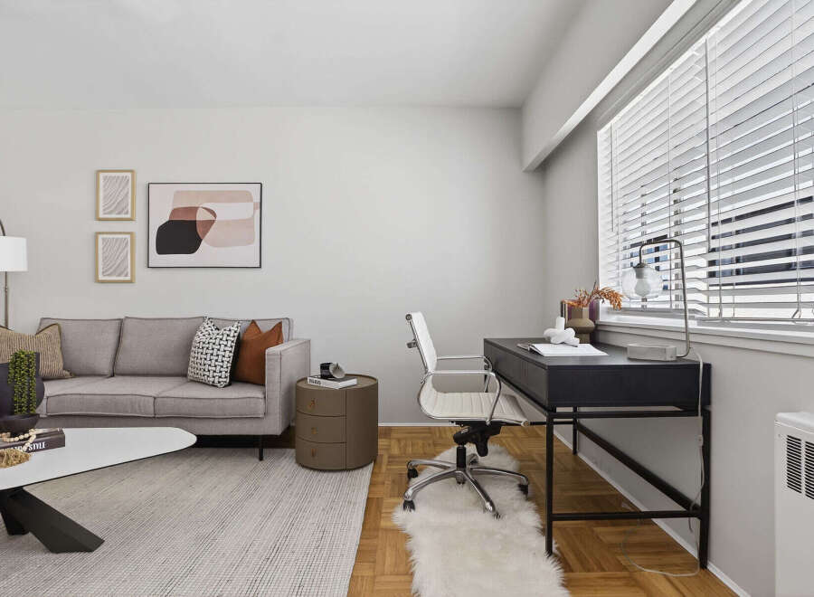 This stylish living space features a modern design with a comfortable sofa, perfect for relaxation.