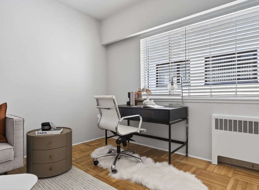 This stylish apartment features a modern home office space, perfect for remote work or creative projects.