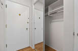 Step into this inviting entryway featuring a mirrored closet and ample storage space.