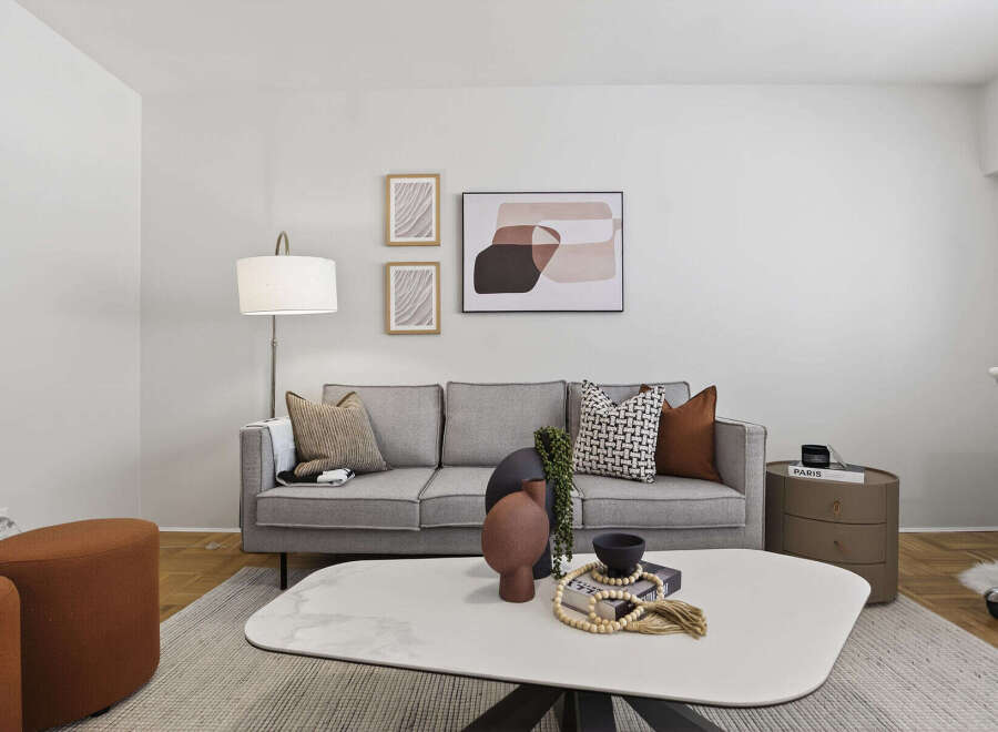 This stylish living room features a modern gray sofa, perfect for relaxing.