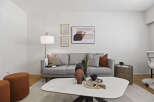 This stylish living room features a modern gray sofa, perfect for relaxing.