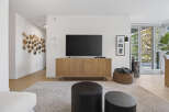 Step into modern elegance with this stunning living space.