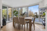 Experience urban living at its finest in this stunning condo! This property boasts a bright and airy dining area with floor-to-ceiling windows, offering breathtaking city views.