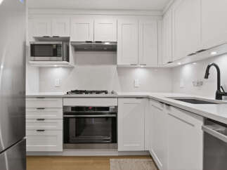 This stunning kitchen boasts modern design and functionality.