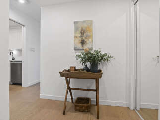 This stunning property boasts a bright and airy hallway, perfect for welcoming guests.