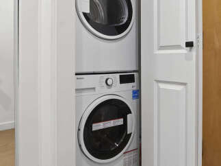 Discover the convenience of in-unit laundry with this stunning property! This home features a modern stacked washer and dryer, making laundry day a breeze.