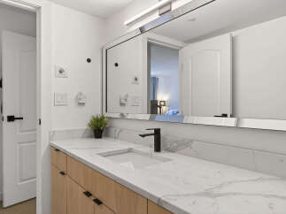 Step into luxury with this stunning bathroom! Featuring a sleek marble countertop, modern black faucet, and ample cabinet space, this bathroom is designed for both style and functionality.