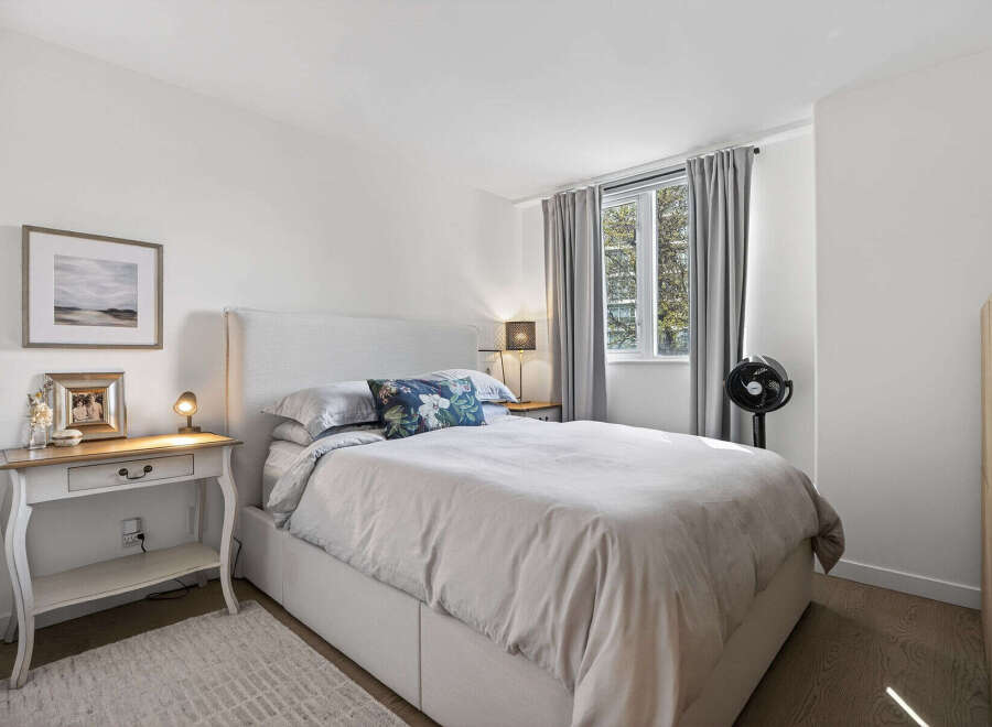 This inviting bedroom features a comfortable bed with soft bedding and a stylish headboard.