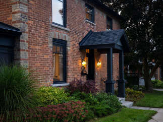 This stunning brick home exudes timeless charm and curb appeal.