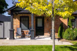 Charming brick home with a welcoming front porch.